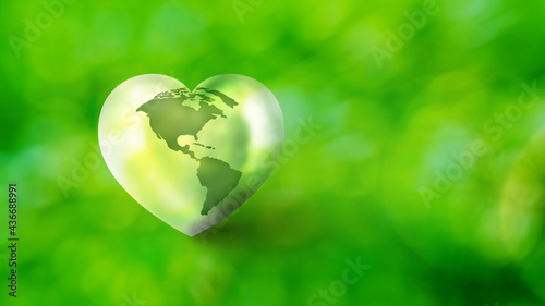 Heart shape earth map on blurred bokeh background, Love and Save the World for the Next Generation concept, Green world day concept
