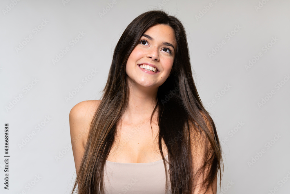 Teenager Brazilian girl over isolated background Teenager Brazilian girl over isolated background