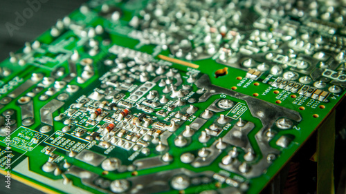 Electronic printed circuit board with soldered contacts on the reverse side of the parts.