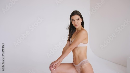  sporty girl in lingerie posing in the studio. Healthy lifestyle concept. Beautiful female body