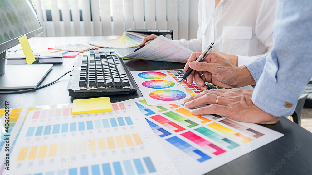 Young graphic design entrepreneur tired of trial and error approach of her colleagues working Young graphic design entrepreneur tired of trial and error approach of her colleagues working
