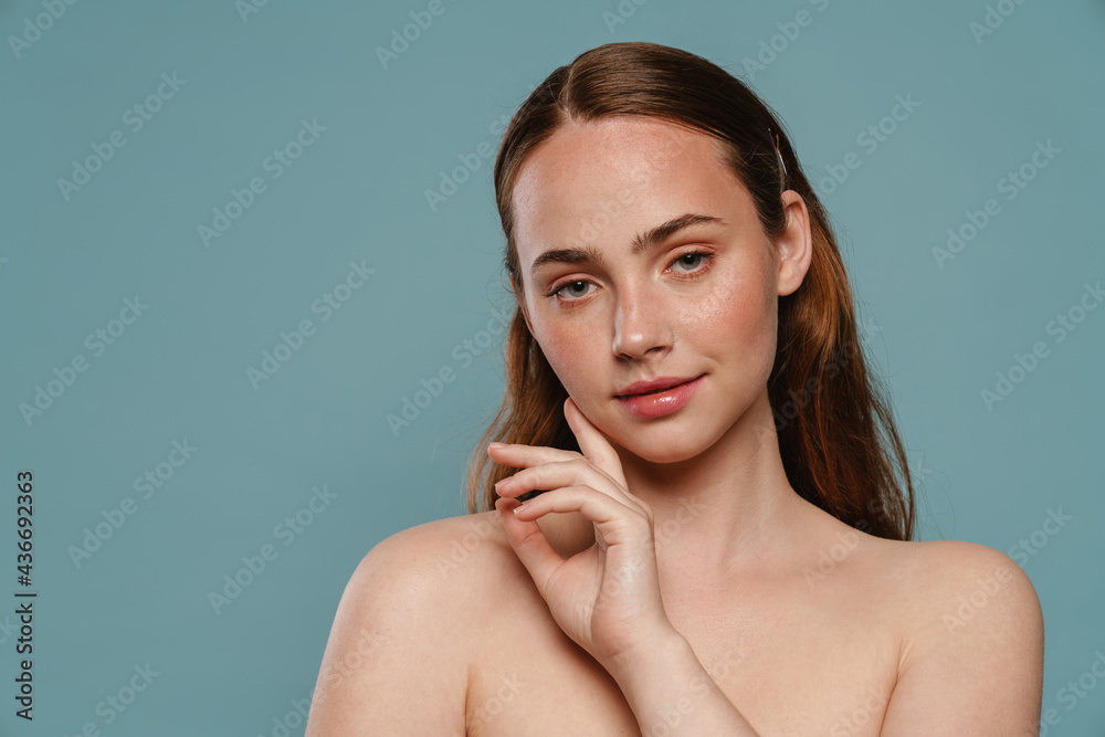 Half-naked ginger woman posing and looking at camera Half-naked ginger woman posing and looking at camera
