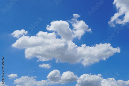 white cumulus clouds in the blue sky © nawin