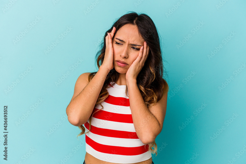 Young mexican woman isolated on blue background whining and crying disconsolately. Young mexican woman isolated on blue background whining and crying disconsolately.