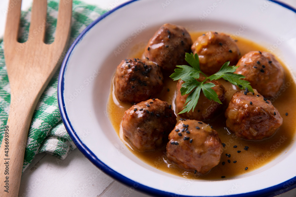 Tapa of meatballs with homemade sauce in a Spanish restaurant. Tapa of meatballs with homemade sauce in a Spanish restaurant.