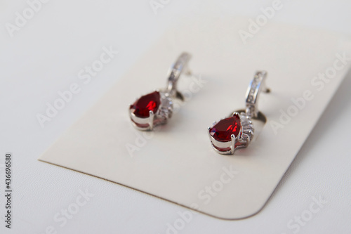 Ruby diamond earrings on white background