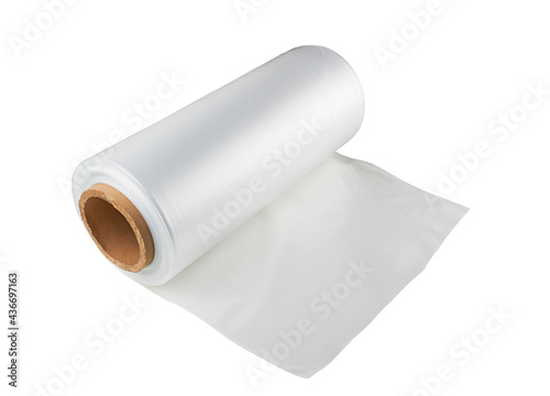 A roll of wrapping plastic film on a white background. Polypropylene or polyethylene rolls for packaging in food bags. © Denis