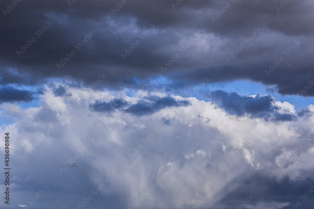 Dramatic thunderstorm clouds background at blue sky Dramatic thunderstorm clouds background at blue sky