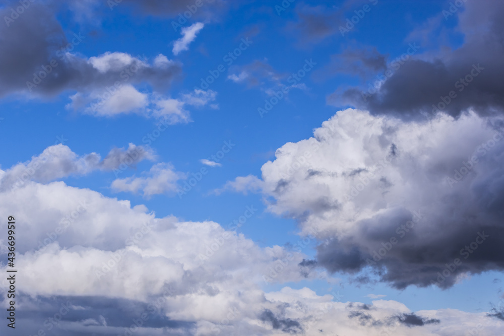 Obraz premium Dramatic thunderstorm clouds background at blue sky