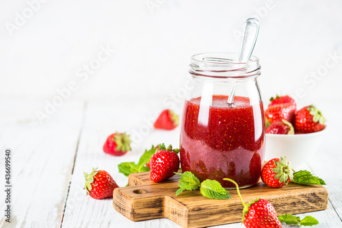 Wallpaper Mural Strawberry jam in the glass jar at white table with fresh strawberries. Torontodigital.ca