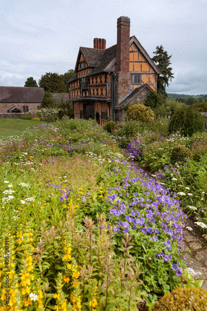 The gatehouse, circa 1641, Stokesay Castle, Shropshire, UK: an example of the Marches style of lavishly showy timber-framing, seen from across the glorious herbaceous borders