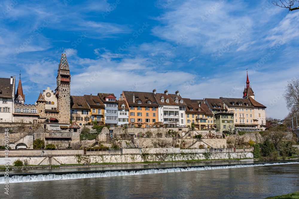 Cityscape of old town Bremgarten at riverside of Reuss on sunny day, canton Aargau Switzerland. The tower was build early 1900. The house Muri-Amthof was the house of administration of the Muri Abbey.