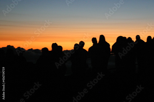 Mount Haleakala Maui, Hawaii, with Cloudy Sunrise with People Enjoying the View with Silhouettes starting a new Day © Gary Peplow