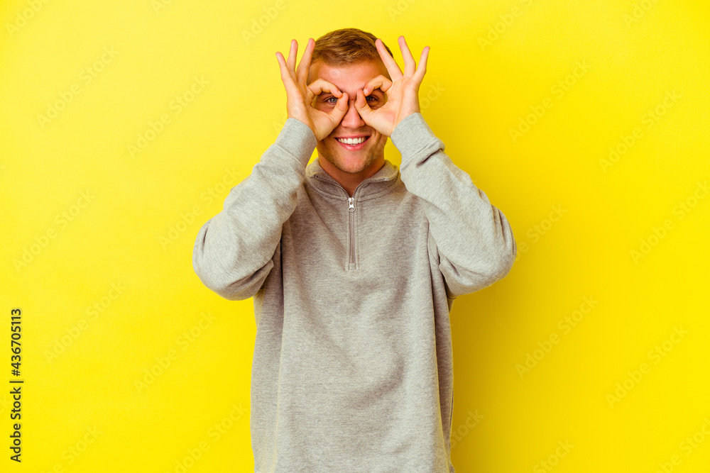 Young caucasian man isolated on yellow background Young caucasian man isolated on yellow background