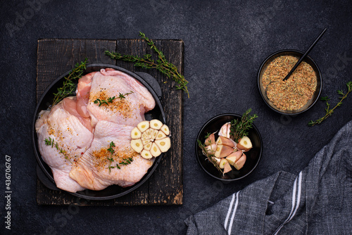 Raw uncooked chicken thighs with garlic