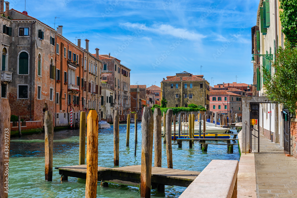 Canal with boats in Venice, Italy. Architecture and landmark of Venice. Cozy cityscape of Venice.