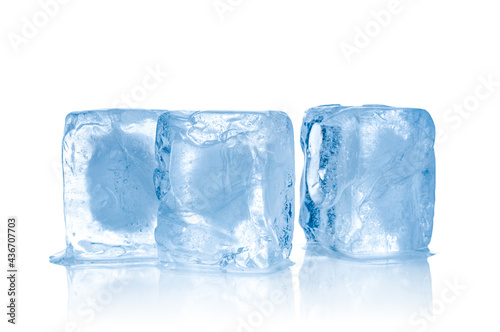 Three ice cubes close up isolated on white background