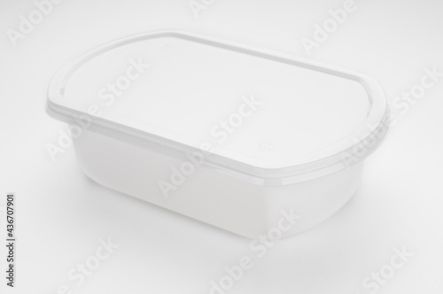 Disposable plastic food container close up on white background