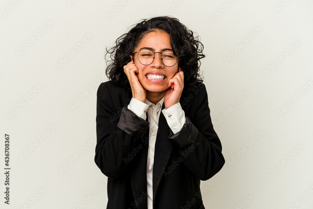 Young latin business woman isolated on white background covering ears with hands. Young latin business woman isolated on white background covering ears with hands.