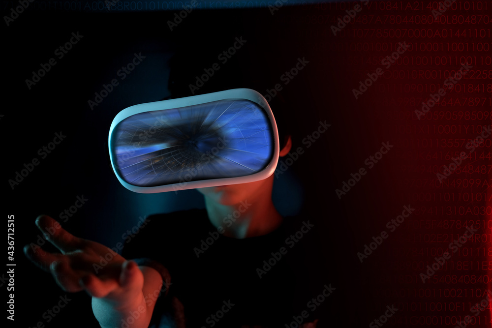 boy, child in dark room with neon lights in modern VR glasses interacting with network while having virtual reality experience, concept study of another world, modern teaching technologies