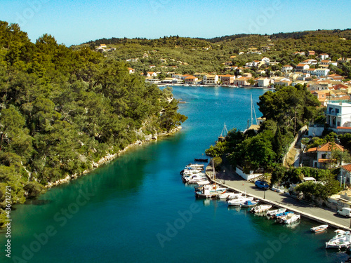 Yachts and boats in paxos harbour on the ionian greek island holiday resort.