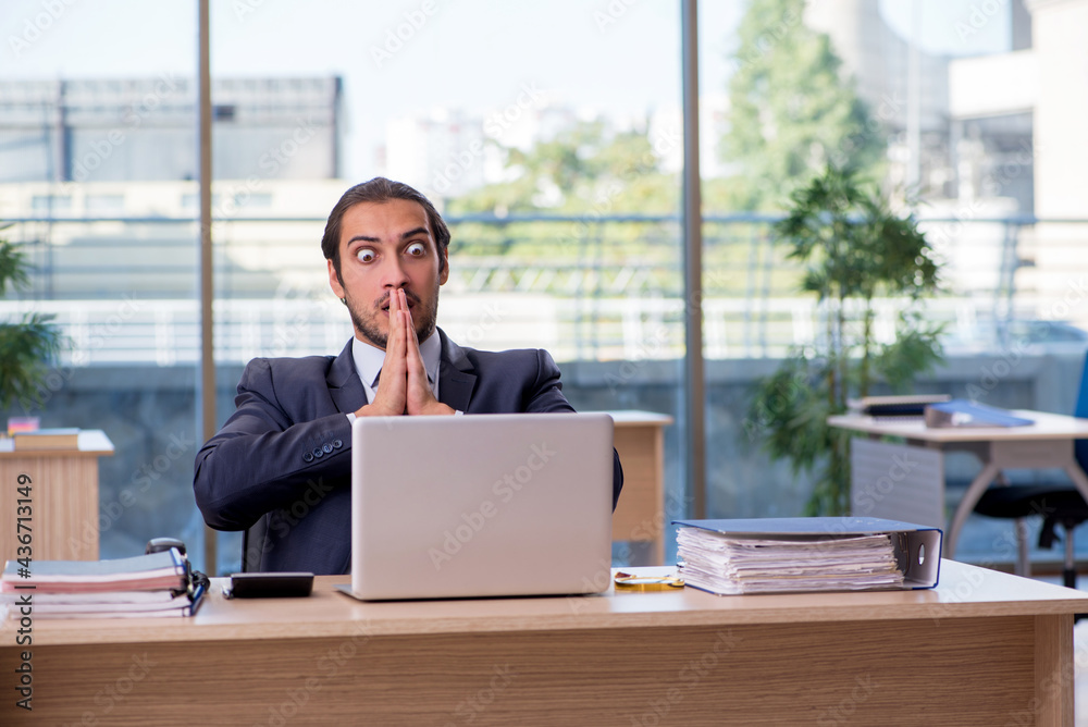 Young businessman employee working in the office Young businessman employee working in the office