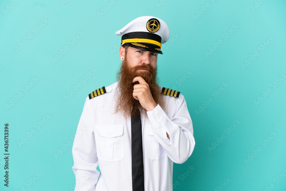 Redhead caucasian man playing rugby isolated on yellow background having doubts and thinking Redhead caucasian man playing rugby isolated on yellow background having doubts and thinking