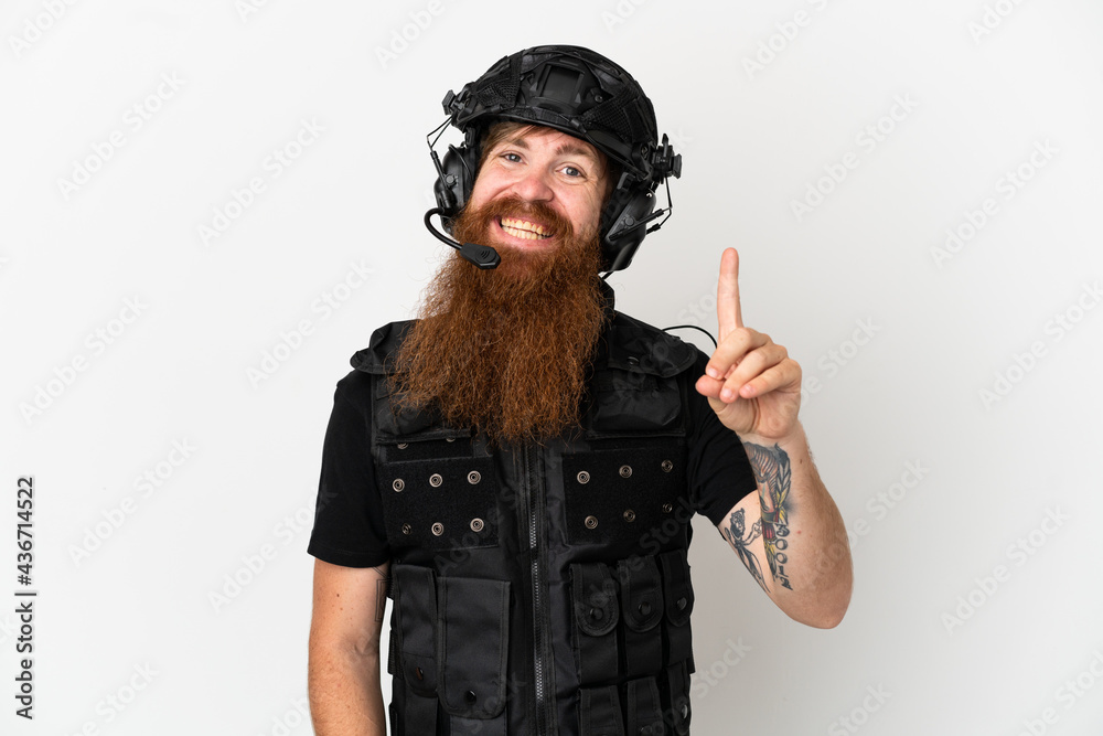 Redhead SWAT isolated on white background showing and lifting a finger in sign of the best Redhead SWAT isolated on white background showing and lifting a finger in sign of the best