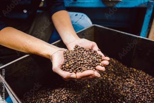 Barista with fresh coffee beans