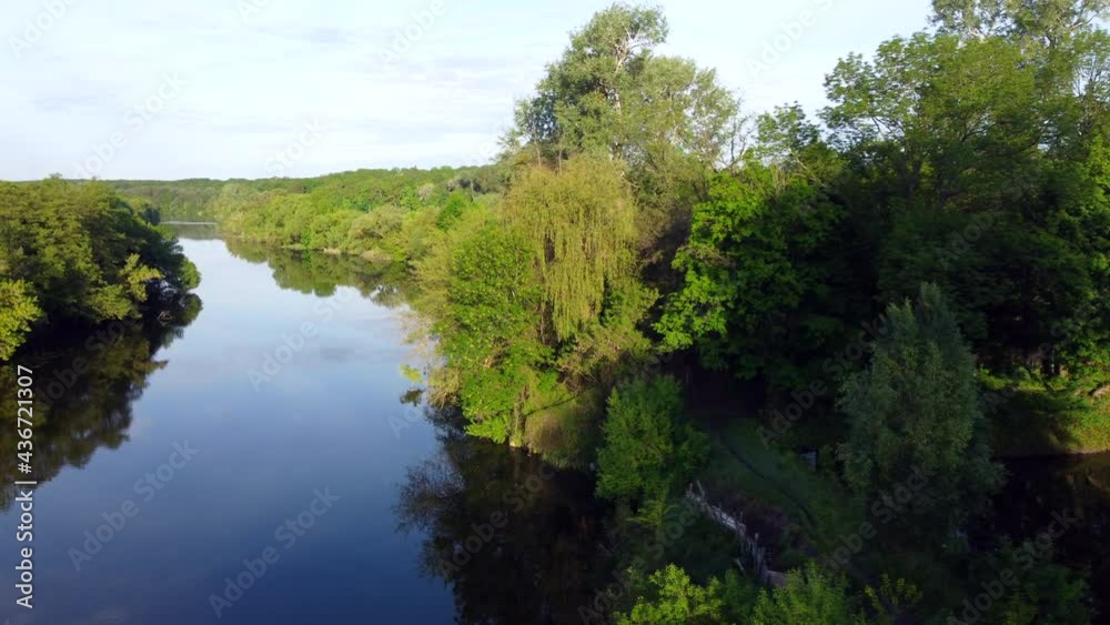 Aerial drone view flight over mirror smooth surface of river and trees Aerial drone view flight over mirror smooth surface of river and trees