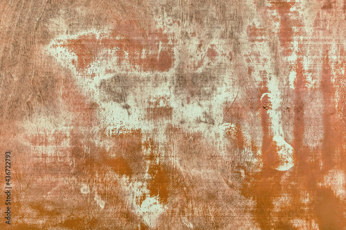 Peeling orange paint abstract texture from old worn light wood background
