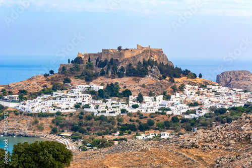 Lindos town cityscape with acropolis over old town, Rhodes island, Greece