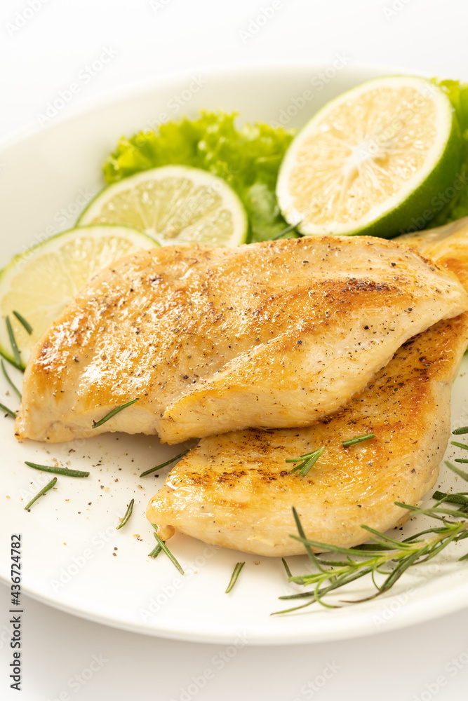 Pan-fried chicken breast on a solid background Pan-fried chicken breast on a solid background