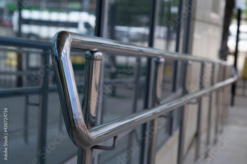 Stainless steel railing on the city street. Long-lasting railing.