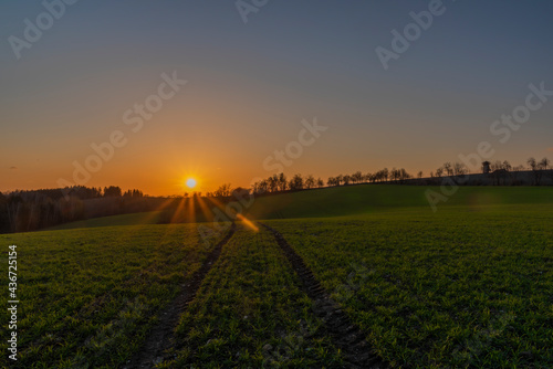Sunset view in Roprachtice village in Krkonose mountains with color sky photo