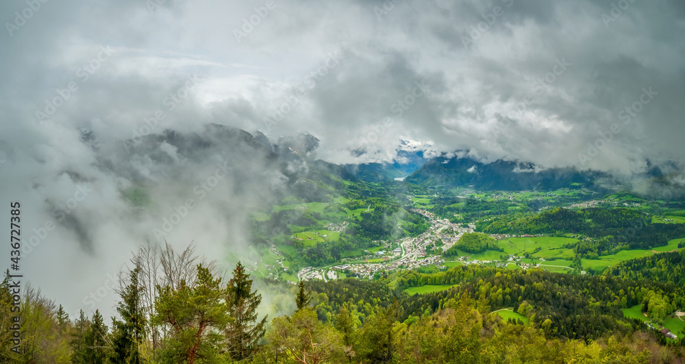 Top mountain view from Kneifelspitze to the City of Berchtesgaden with huge rain clouds at the background Top mountain view from Kneifelspitze to the City of Berchtesgaden with huge rain clouds at the background