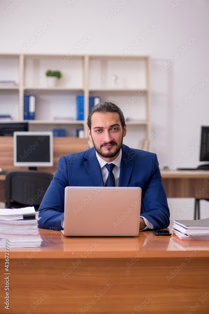 Young businessman employee working at workplace Young businessman employee working at workplace