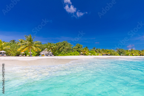 Amazing beach with palm trees sea sand sky. Stunning summer vacation travel holiday panoramic shore, coast. Maldives paradise beach. Luxury resort hotel, gorgeous travel seaside landscape background