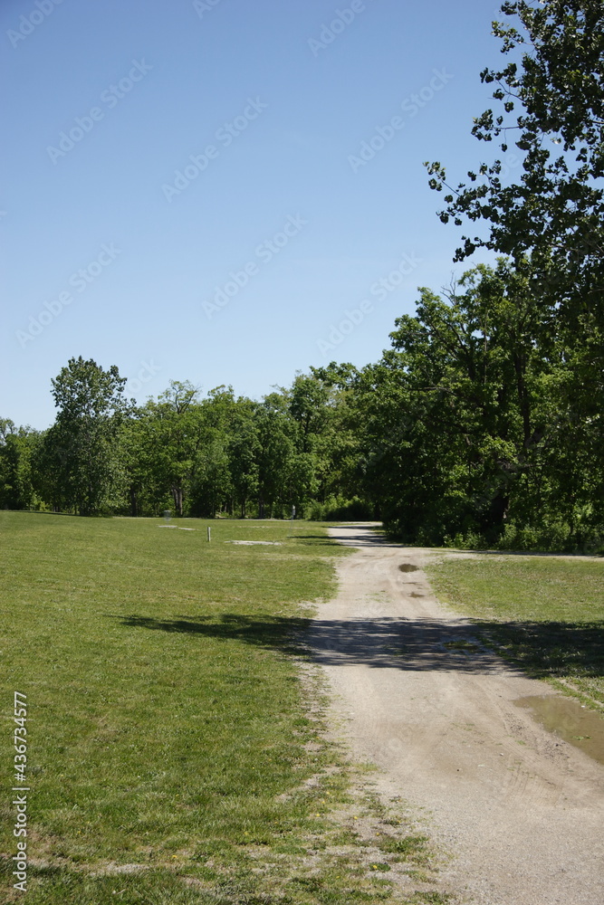 Gravel path in the park on a clear and sunny day Gravel path in the park on a clear and sunny day