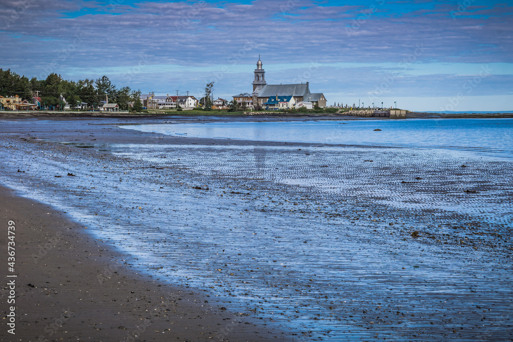 The beach of Ste Luce at low tide and in the background the church of Ste Luce on a beautiful morning