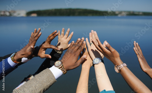Black Lives Matter. Hands of different people raised up. It symbolizes equality between people. No racism!