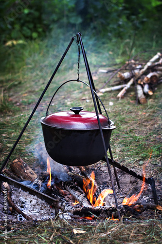 A pot over the fire. Summer vacation, hike, tourism