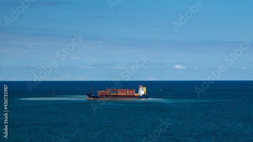 Small container ship run aground and use engine to salvage itself
