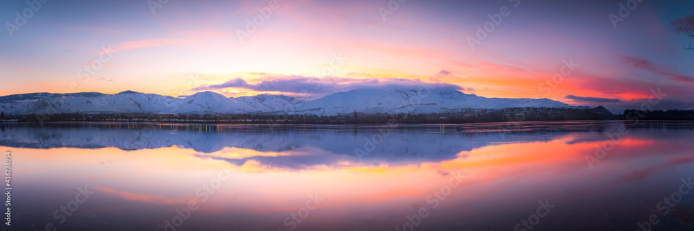 Cold Winter Sunset Over Beautiful River and Mountains