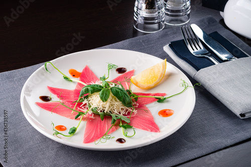 Tuna carpaccio on a plate