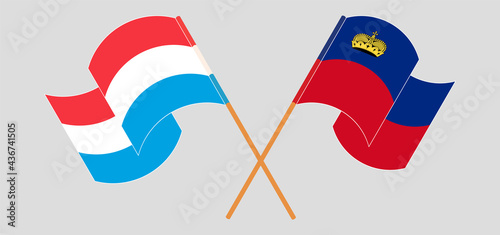 Crossed and waving flags of Luxembourg and Liechtenstein