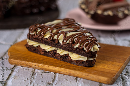 Piece of brownie pizza with powdered milk brigadeiro filling