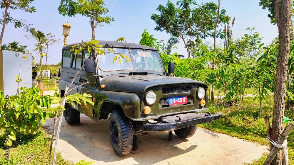 Obraz premium UAZ-469 off-road military light utility vehicle. Old Soviet car with Cambodian plate. Phnom Penh. Cambodia. Asia