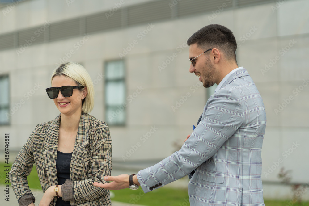 Business parnters are talking and smiling Business parnters are talking and smiling