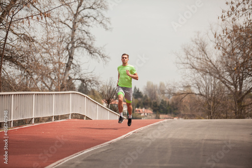 Running on his trail on the bridge